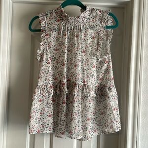 Floral sleeveless blouse.